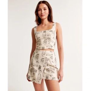 Two-Piece Cream & Black Illustrated Crop Top + Skort Set